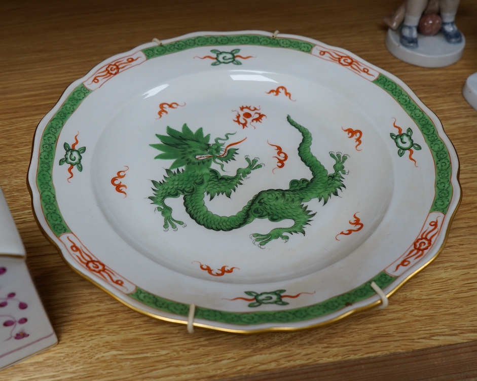 A Meissen dish, painted with a green dragon, 25.5cm diameter, another painted with an iron red dragon and a tea caddy (3). Condition - good